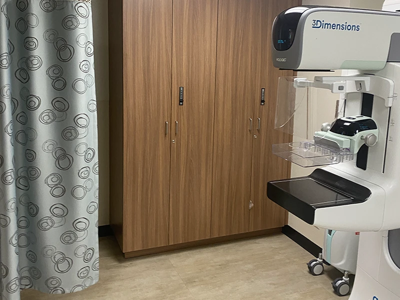 Mammography suite renovation with new cabinetry and 3D imaging equipment installed in an active hospital facility